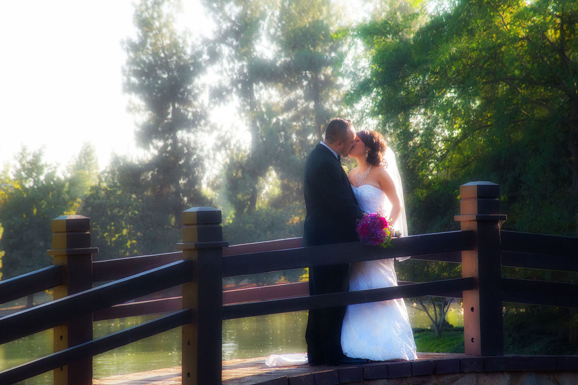 Bride and groom walking together on a bridge on their wedding day